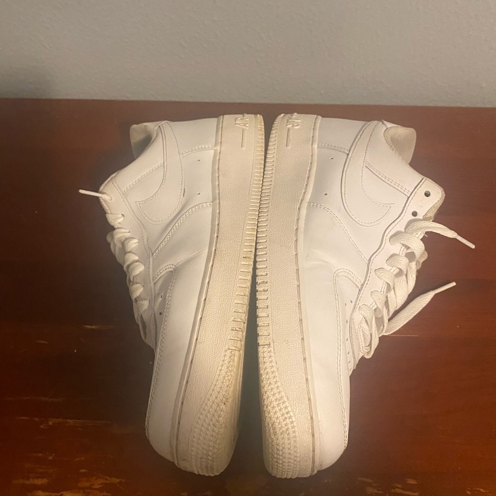 Nike White Athletic Shoes Air Force 1 missing one of Chrome Air Force Symbols